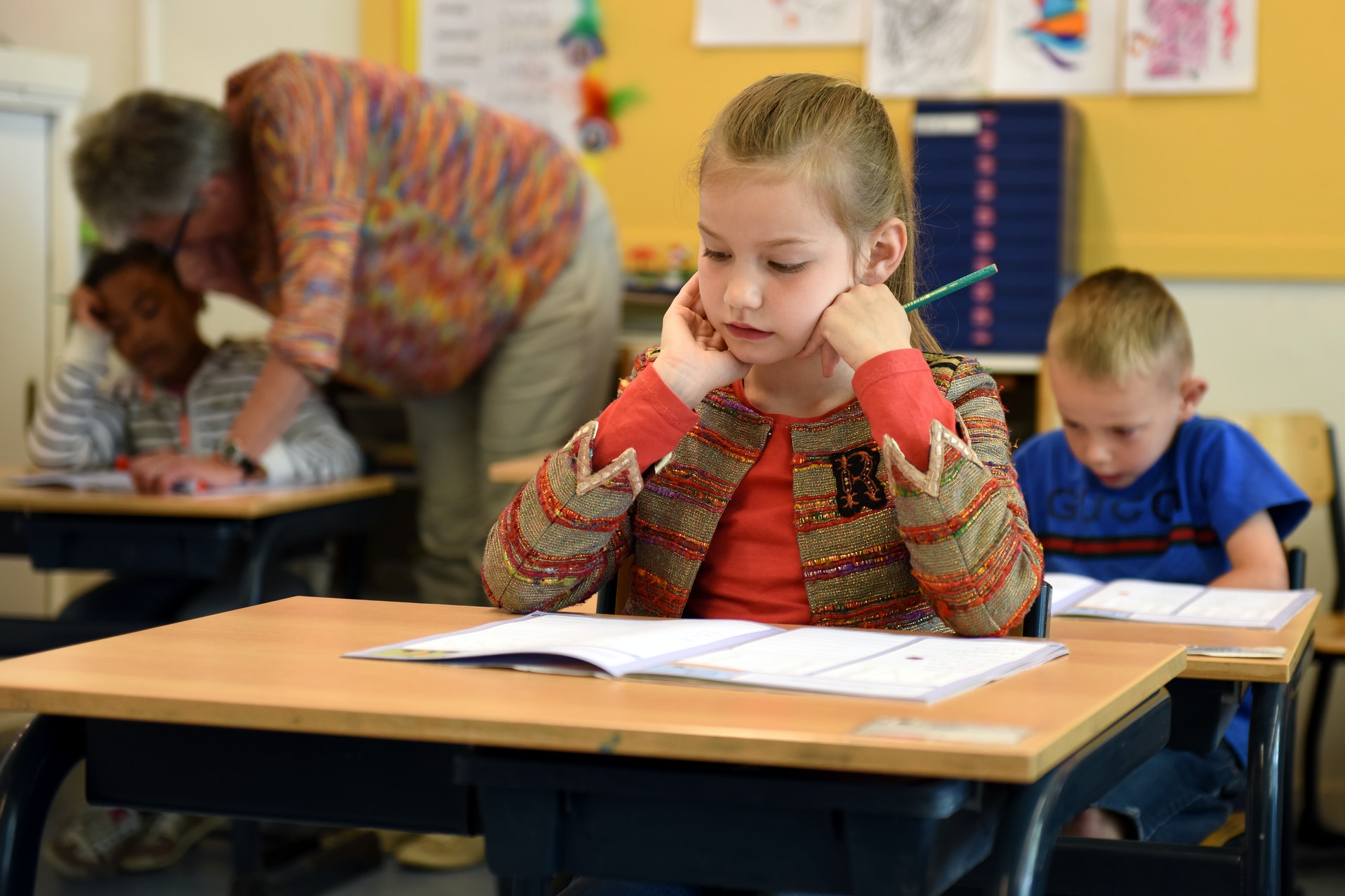 The Importance of School Cleanliness. Child sitting at desk in school