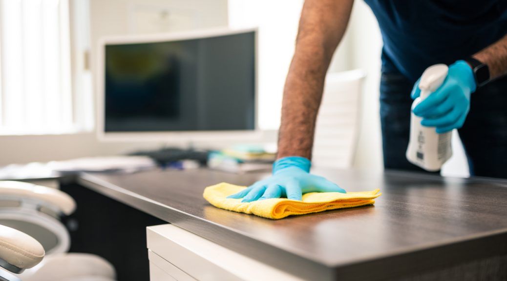 disinfecting office to keep office clean