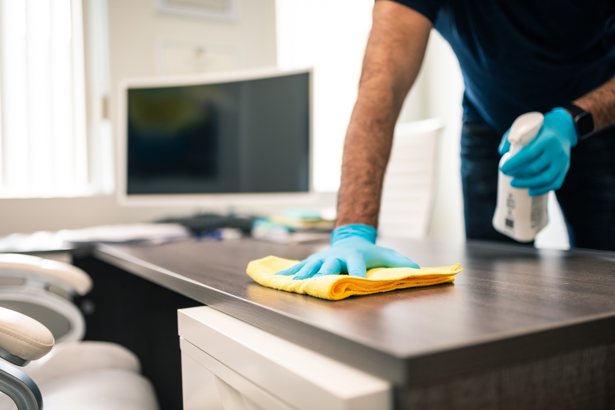 disinfecting office to keep office clean